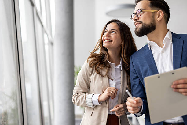 istock Business colleagues sharing a vision while looking out office window 2223084863