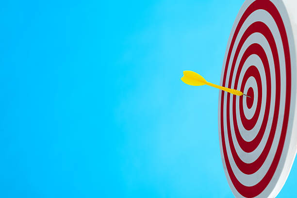 istock Dart arrow on center of dartboard 2223085001