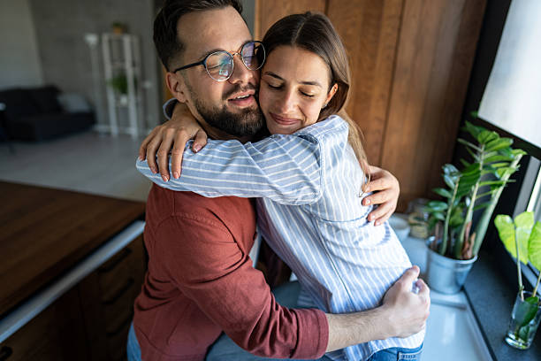 istock Young couple sharing a tender hug in their modern kitchen 2223085028