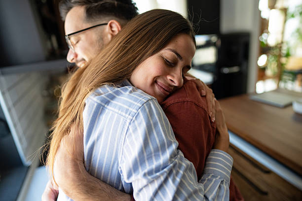 istock Young couple embracing tenderly in their modern kitchen 2223085180