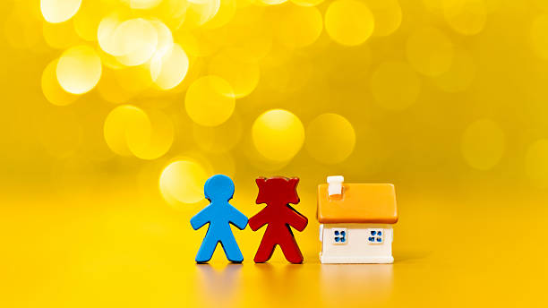 Couple and house on shiny background.