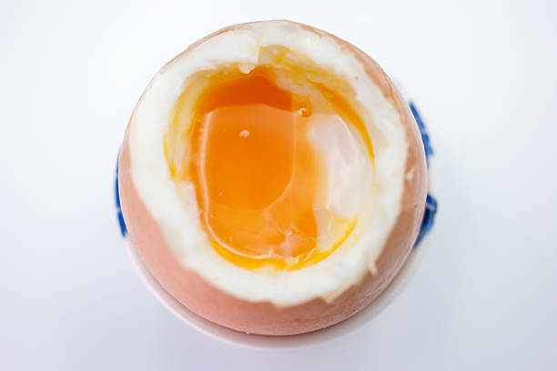Image of the saying better half an egg than an empty cap on a background of white salt.