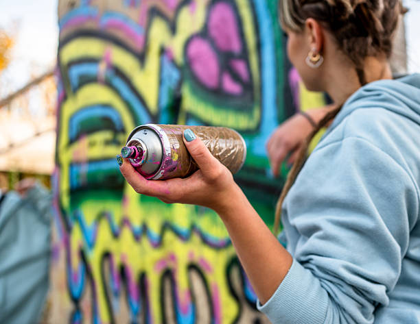 istock Street artist holding spray can creating graffiti art 2223085637