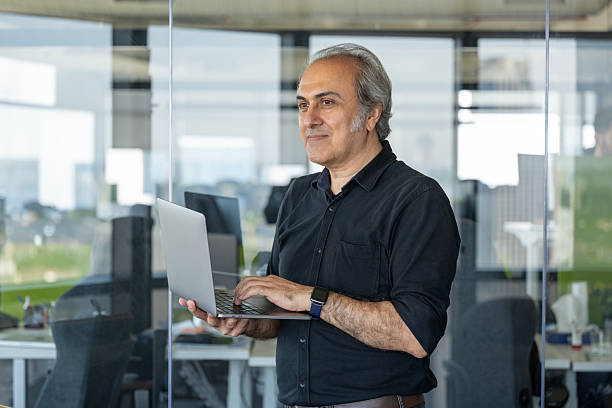 istock Senior Executive Working on Laptop in Office 2223086925
