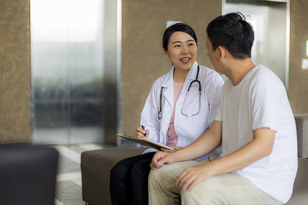 istock Professional Caregiver Advising Patient 2223088263