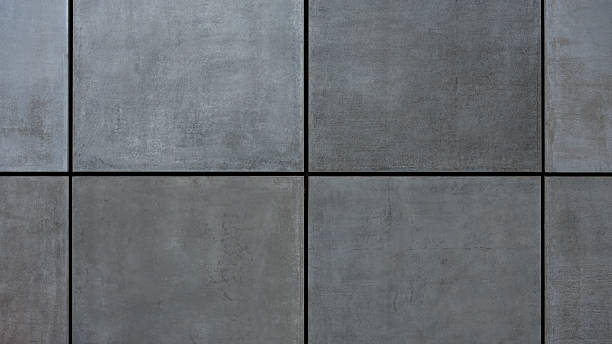 istock Close-up of a modern concrete wall with large rectangular grey panels 2223089090