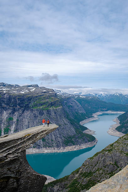 istock Breathtaking view from Trolltunga in Norway with hikers exploring stunning landscapes 2223089547