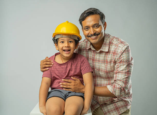 istock Man with wearing hardhat to son on white background 2223089805