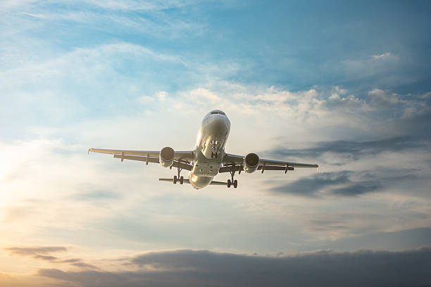 istock Airplane is preparing for landing at sunset. 2223089944