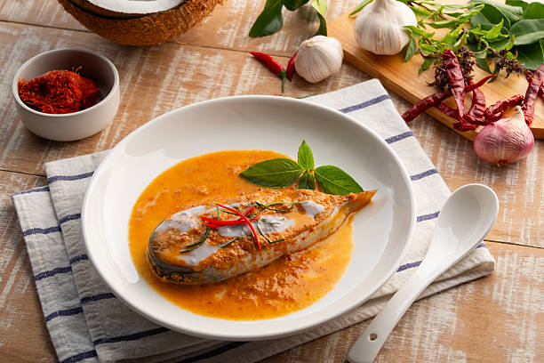 istock Siriped catfish with dried red curry sauce. 2223090093