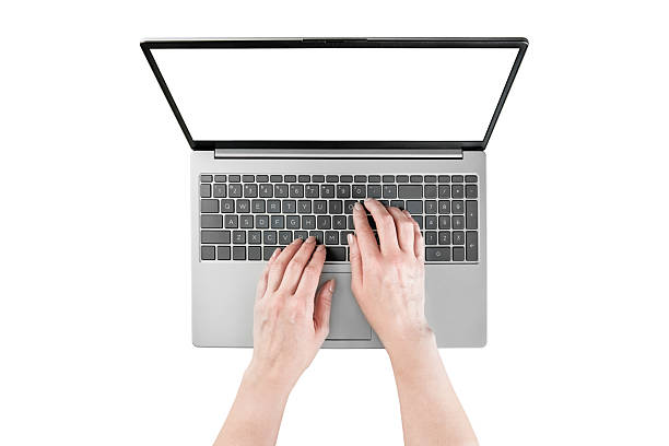 Female hands typing text or working on laptop with empty screen isolated on white background with clipping path. Top view. Design element