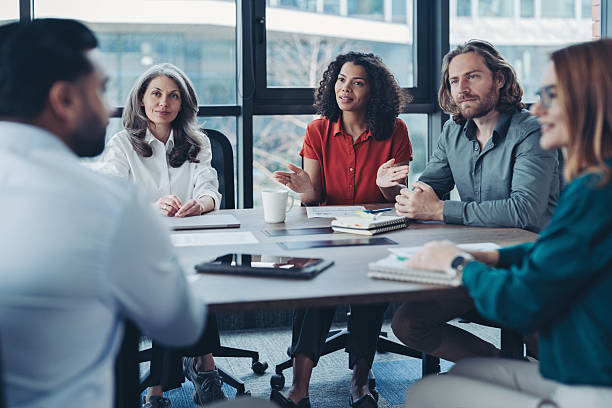 istock Business people talking around the table 2223091345