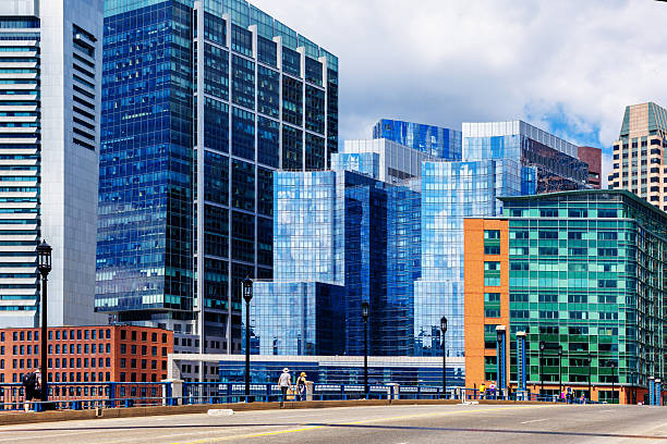 Boston, Massachusetts, USA - June 29, 2025: View from the Seaport District across the Congress Street Bridge over Fort Point Channel. Looking towards the downtown Boston waterfront skyline and its business and financial district.