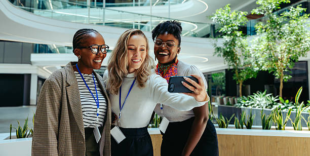 istock Three businesswomen taking a selfie in a modern office space 2223095942