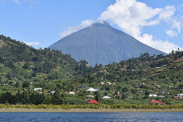 Mount Nyiragongo Rising Over a Lakeside Village