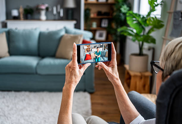 istock Senior woman using smartphone for video call with doctor 2223099067