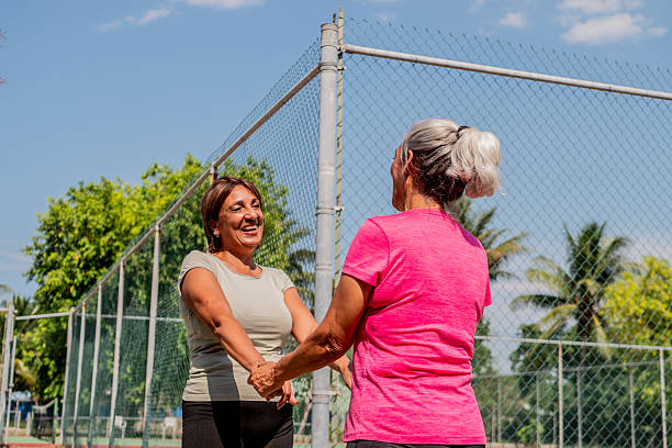 istock Senior friends women talking on public park 2223101439