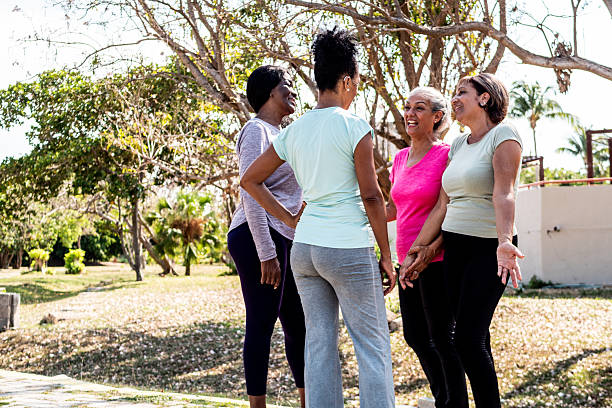 istock Senior friends women talking on public park 2223102075