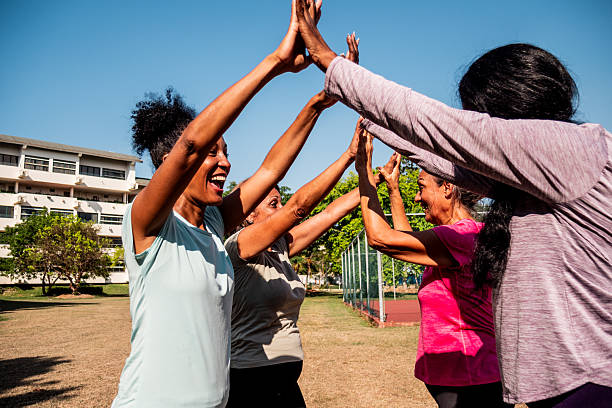 istock Senior friends women doing high-five on public park 2223102108