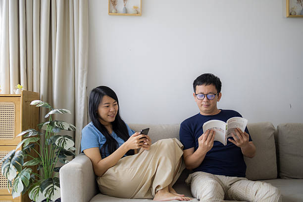 istock Relaxed Couple Having Fun at Home on Sofa 2223102612