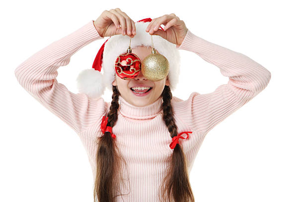 istock Young girl in santa hat with baubles on white background 2223103530