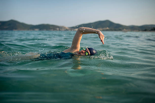 istock Determined woman swimming in sea. 2223106841