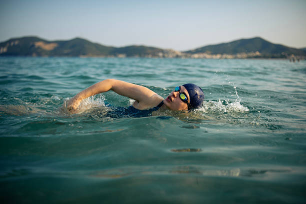 istock Determined woman swimming in sea. 2223106851