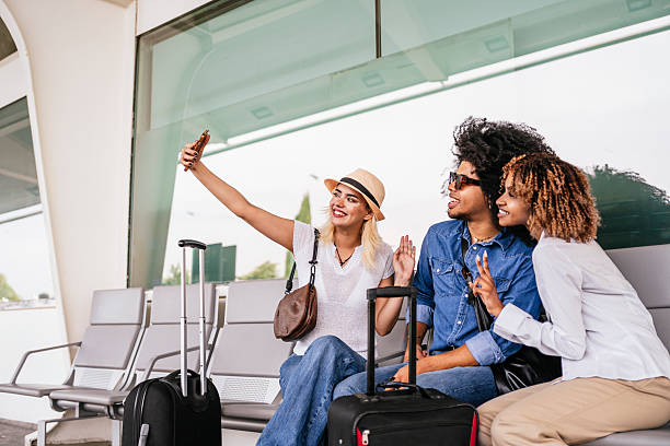 istock Young tourists taking selfie while waiting at the airport 2223106925