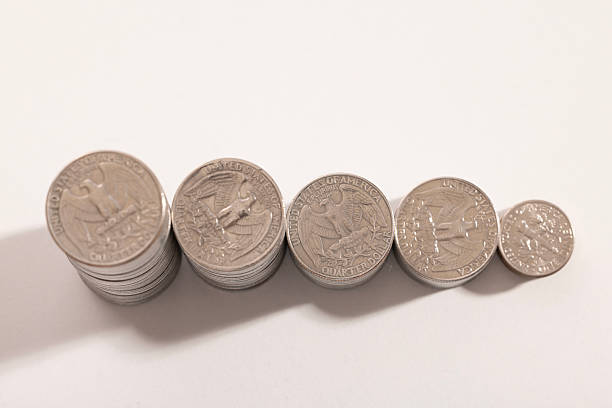 istock A stack of dollar coins stacked on each other in different positions. Money 2223109376