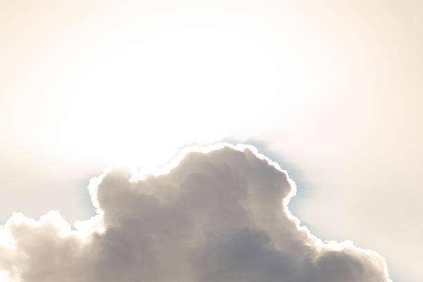 Dark clouds against bright sun and sky. Space. Background. Backdrop.
