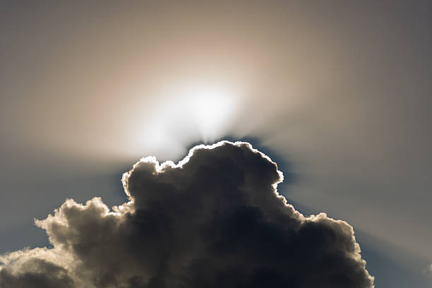 The sun is behind the clouds, forming a light edge