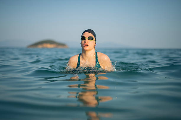 istock Determined woman swimming in sea. 2223114445