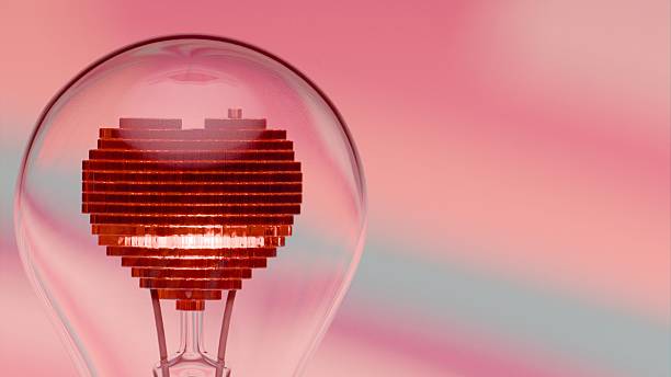 istock Light bulb with pixelated heart shaped filament under radial striped background 2223114532