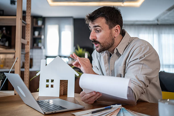 istock Architect presenting a project to his clients in a video call from his home office 2223122639