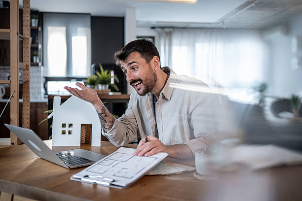 istock Architect presenting a new house project during a video call 2223122889