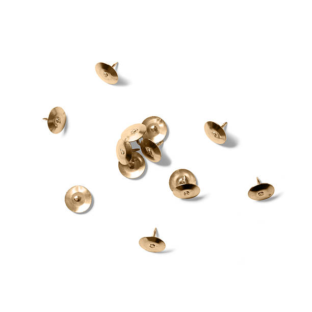 istock Brass Thumbtacks or Push Pins isolated on a white background. 2223125394