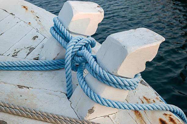 Detail image of yacht rope cleat on sailboat deck