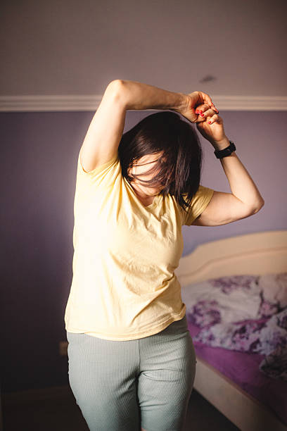 istock Woman exercising while waking up in the morning 2223132414