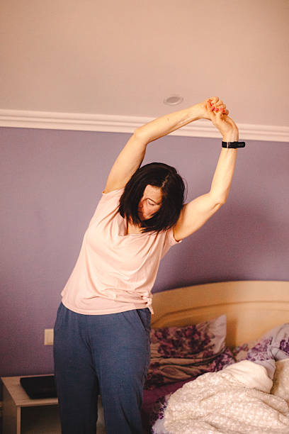 istock Woman exercising while waking up in the morning 2223132468