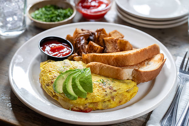 Avocado omelette with home fries and toast