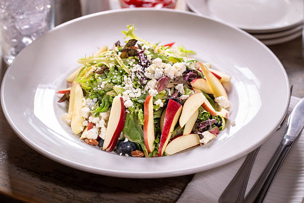 Fresh Greek salad with sliced apples and feta cheese