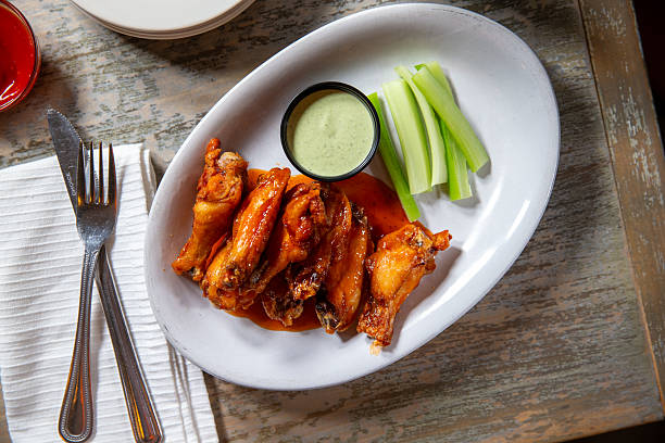 istock Top down angle of Buffalo chicken wings with celery 2223133337