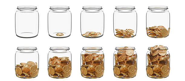 istock A set of transparent glass jars, each containing a different amount of coins. Empty, partially filled, and full symbolizing stages of saving, financial progress, or budgeting growth. 2223138312