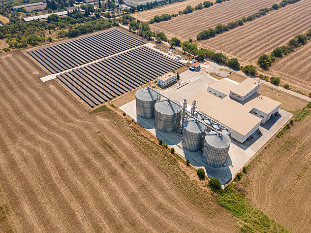 istock Farming & Sustainability. Agricultural Silos in Field & Solar Panels. 2223138820