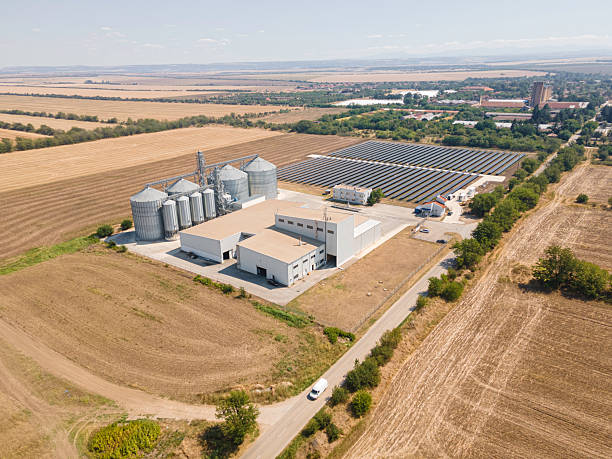istock Farming & Sustainability. Agricultural Silos in Field & Solar Panels. 2223138821