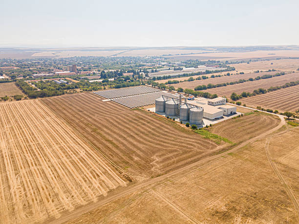 istock Farming & Sustainability. Agricultural Silos in Field & Solar Panels. 2223138824