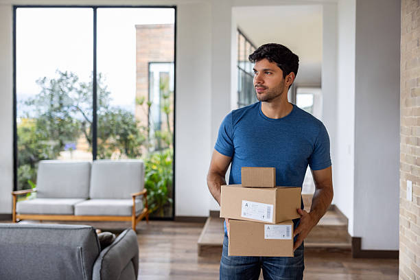 istock Man at home receiving packages in the mail 2223141300