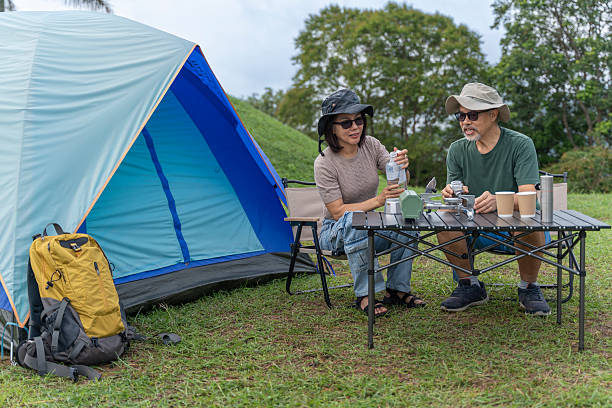 istock Senior Couple Preparing Coffee at Campsite 2223143447