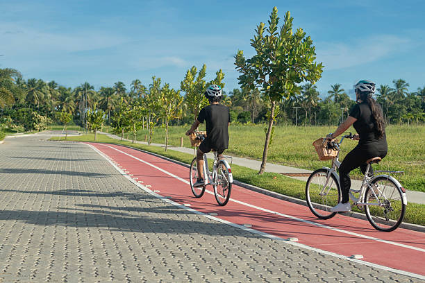 Friends cycling in a recreational area on a sunny day