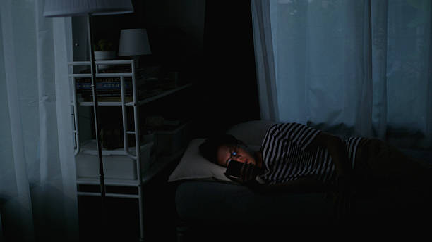 istock Last Scroll of the Day – Asian Man on Phone Before Sleep. 2223145062